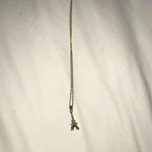 adorable gold Eiffel tower necklace